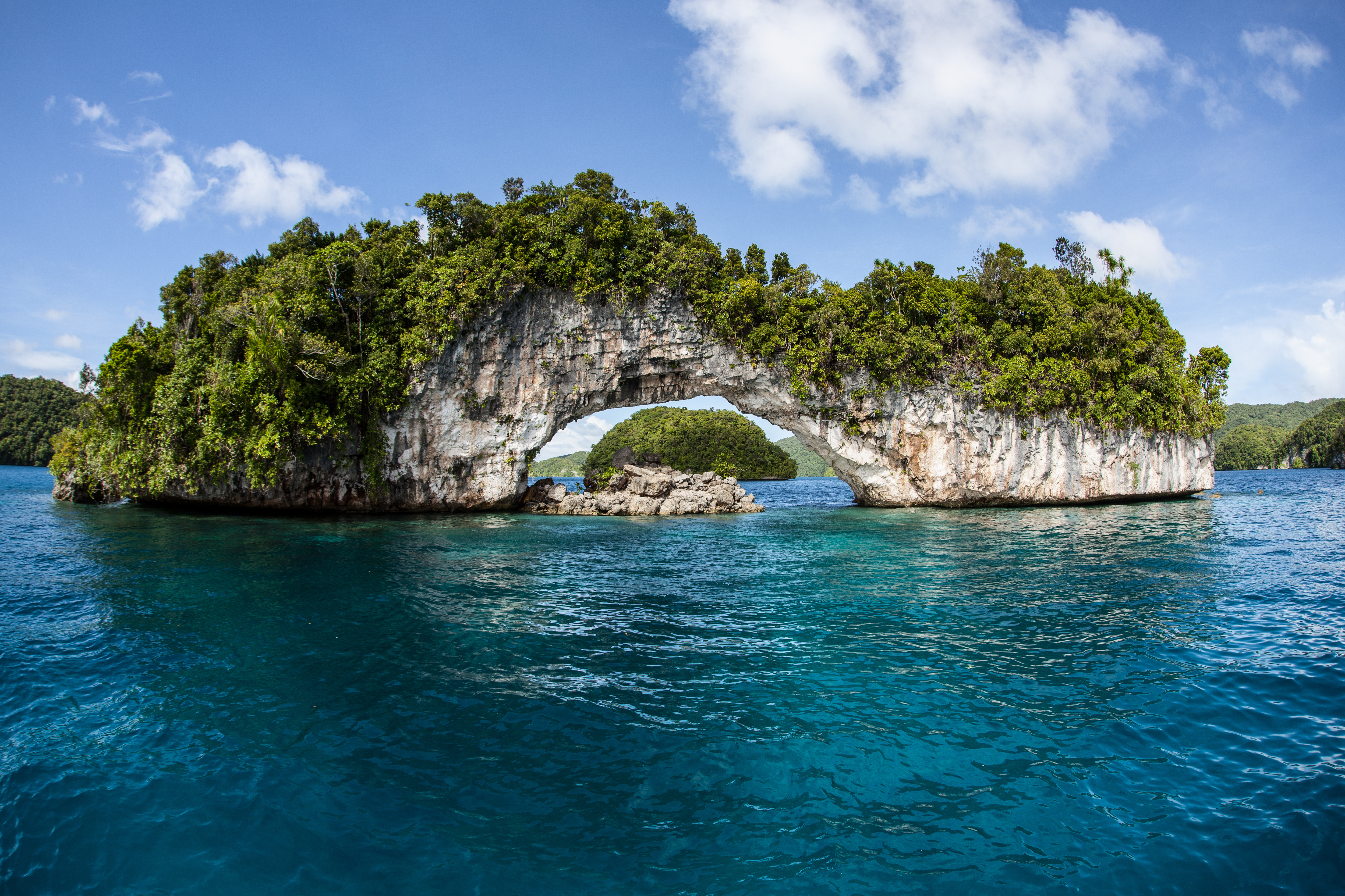 Image of a limestone arch over water